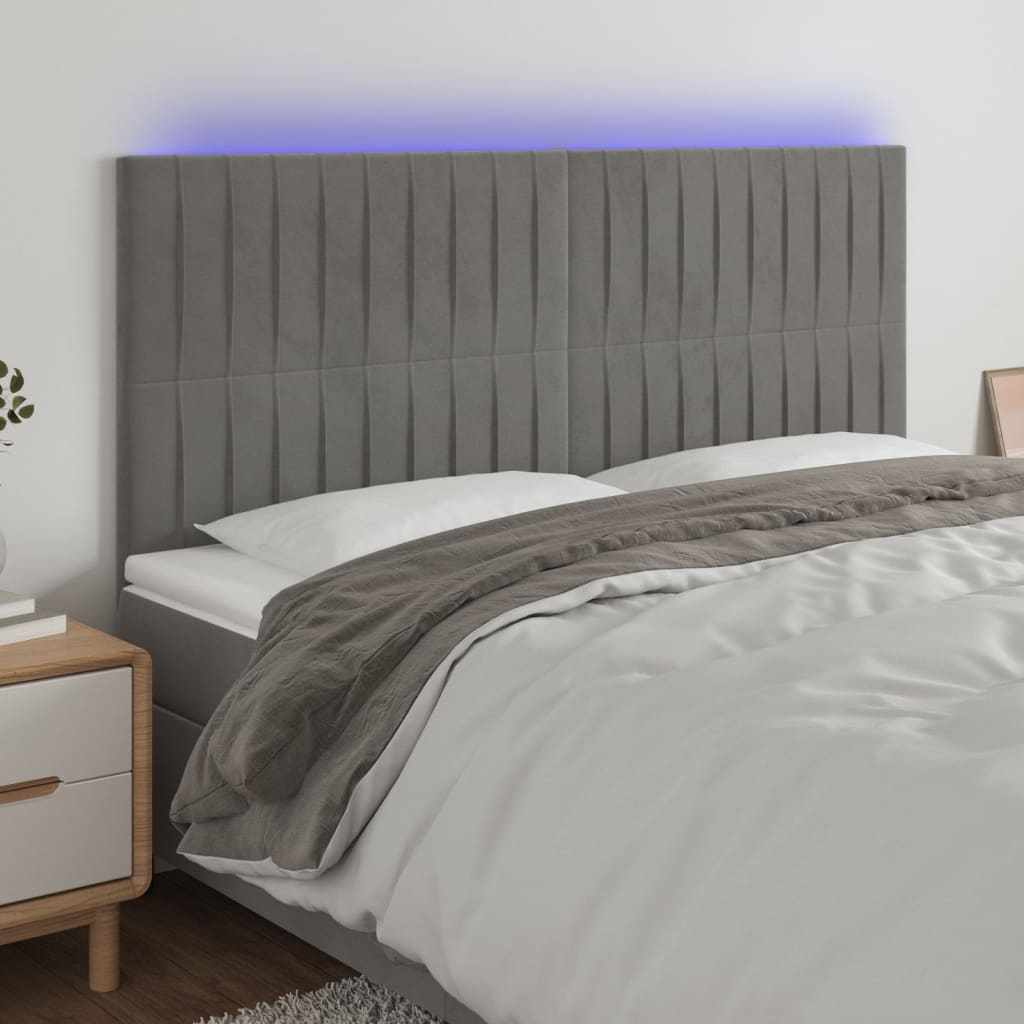 Sänggavel LED ljusgrå 160x5x118/128 cm sammet