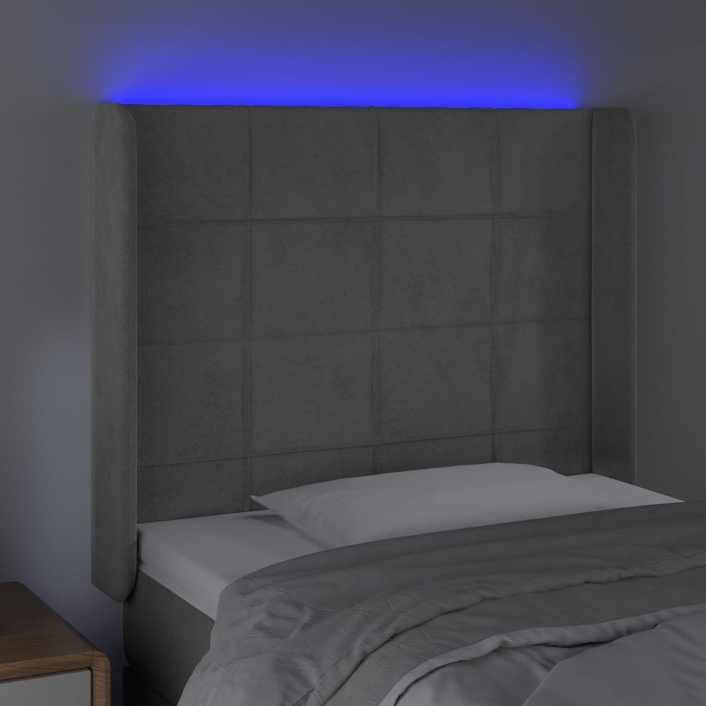 Sänggavel LED ljusgrå 83x16x118/128 cm sammet