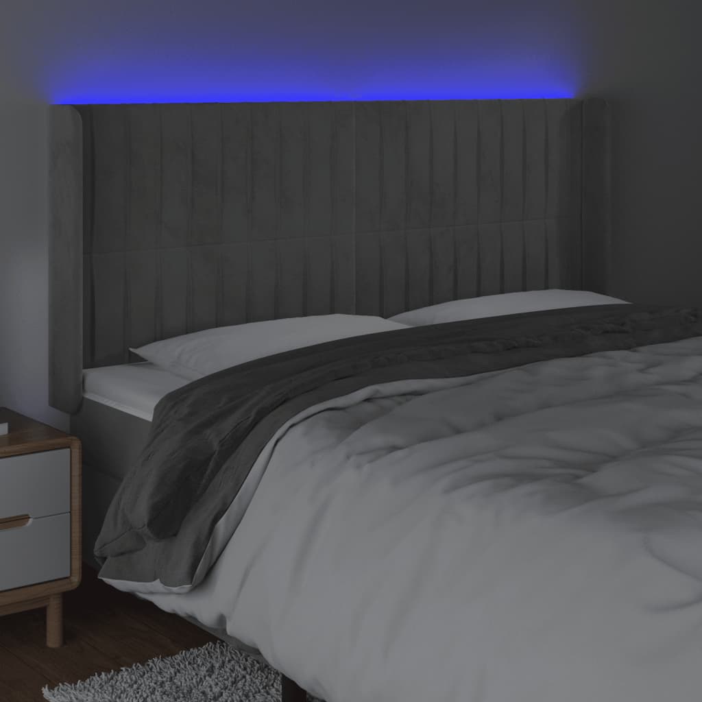 Sänggavel LED ljusgrå 163x16x118/128 cm sammet