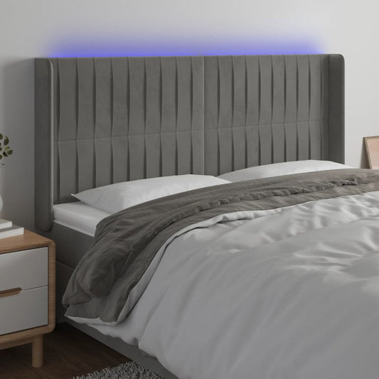 Sänggavel LED ljusgrå 163x16x118/128 cm sammet