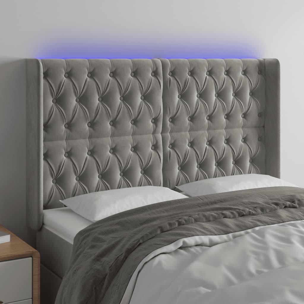 Sänggavel LED ljusgrå 163x16x118/128 cm sammet